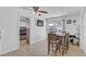 Multi-purpose dining area featuring a modern table, chairs, and natural light at 2718 Boca Ciega N Dr, St Petersburg, FL 33710