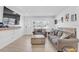 Bright living room with a wooden coffee table and cozy sofas, bathed in natural light at 2718 Boca Ciega N Dr, St Petersburg, FL 33710