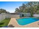 Backyard in-ground pool with a brick patio is perfect for relaxing or entertaining at 2718 Boca Ciega N Dr, St Petersburg, FL 33710