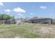 Expansive backyard with covered patio, sheds, offering plenty of space for outdoor activities and storage at 2809 49Th N St, St Petersburg, FL 33710
