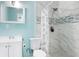 Bathroom featuring a tiled shower, updated vanity, and modern fixtures at 2809 49Th N St, St Petersburg, FL 33710