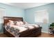 Comfortable bedroom with a large window for natural light and warm color palette at 2809 49Th N St, St Petersburg, FL 33710