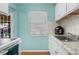 Kitchen featuring white cabinets, granite countertop, and stainless steel appliances at 2809 49Th N St, St Petersburg, FL 33710