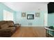 Cozy living room with laminate floors, neutral walls, and comfortable seating at 2809 49Th N St, St Petersburg, FL 33710