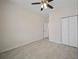 The bedroom has neutral-colored tiled floors and a closet with bifold doors at 2810 N 75Th St, Tampa, FL 33619
