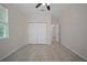 This bedroom has tiled floors and a large closet with doors at 2810 N 75Th St, Tampa, FL 33619