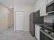 Well-appointed kitchen showcases modern stainless steel appliances and ample cabinet space at 2810 N 75Th St, Tampa, FL 33619
