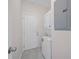 Practical laundry area featuring a stackable washer and dryer for efficient space saving at 2810 N 75Th St, Tampa, FL 33619