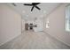 Bright and airy living room features a tiled floor with an open layout that flows into the modern kitchen at 2810 N 75Th St, Tampa, FL 33619