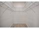 The walk-in closet has tiled floors and metal organizers installed on the walls at 2810 N 75Th St, Tampa, FL 33619