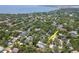 Bird's eye view of the property surrounded by lush greenery and other homes in a waterside neighborhood at 2822 W Bay Ave, Tampa, FL 33611