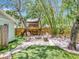 Picturesque backyard features a charming treehouse and relaxing fire pit area at 2822 W Bay Ave, Tampa, FL 33611