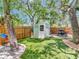 Expansive backyard features a shed, artificial turf, and ample space for recreation at 2822 W Bay Ave, Tampa, FL 33611