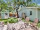 Spacious backyard offers a shed, lush lawn, and charming patio perfect for outdoor gatherings at 2822 W Bay Ave, Tampa, FL 33611