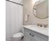 Bathroom features a vanity with a marble countertop and brushed gold hardware at 2822 W Bay Ave, Tampa, FL 33611