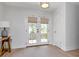 Bright entryway featuring tan window treatments and double doors leading to the outside at 2822 W Bay Ave, Tampa, FL 33611