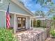 Inviting home featuring a covered front porch with a brick-paved sitting area at 2822 W Bay Ave, Tampa, FL 33611
