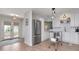 Modern kitchen featuring stainless steel appliances, white cabinets, and an island with shelving at 2822 W Bay Ave, Tampa, FL 33611