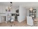 Well-lit kitchen with stainless appliances, white subway tile backsplash, and adjacent dining area at 2822 W Bay Ave, Tampa, FL 33611