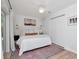 Cozy main bedroom with natural light, ceiling fan, closet, and access to the outdoors at 2822 W Bay Ave, Tampa, FL 33611