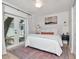 Inviting main bedroom features patio access, soft lighting, and decorative art for a relaxing retreat at 2822 W Bay Ave, Tampa, FL 33611