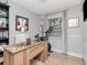 Home office with a large wooden desk and neutral wall color at 2822 W Bay Ave, Tampa, FL 33611