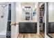 Bathroom with shower and storage cabinet at 30217 Double Dr, Wesley Chapel, FL 33545
