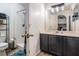 Bathroom with shower, toilet and storage cabinet at 30217 Double Dr, Wesley Chapel, FL 33545