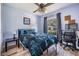 Nicely decorated bedroom with hardwood flooring, desk, fan and outside views at 30217 Double Dr, Wesley Chapel, FL 33545