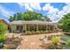 Spacious backyard featuring a pond and patio area, perfect for outdoor relaxation and entertaining at 3273 Tanglewood Trl, Palm Harbor, FL 34685