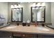 Bathroom featuring double sinks, granite countertops, and warm lighting at 3273 Tanglewood Trl, Palm Harbor, FL 34685