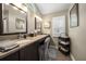 Bright bathroom featuring double sinks, granite countertops and neutral decor at 3273 Tanglewood Trl, Palm Harbor, FL 34685