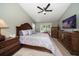 Comfortable bedroom features a ceiling fan, nice furniture, and a sunny window at 3273 Tanglewood Trl, Palm Harbor, FL 34685