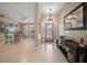 Bright foyer with tile flooring, modern lighting, and an elegant entryway leading to the rest of the home at 3273 Tanglewood Trl, Palm Harbor, FL 34685