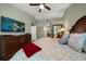 Spacious main bedroom featuring vaulted ceiling, light-green walls and large TV at 3273 Tanglewood Trl, Palm Harbor, FL 34685