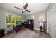 Bright office featuring a ceiling fan, large window, and nice desk setup at 3273 Tanglewood Trl, Palm Harbor, FL 34685