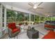 Relaxing screened-in patio showcasing tranquil garden views and comfortable outdoor furniture at 3273 Tanglewood Trl, Palm Harbor, FL 34685