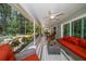 Inviting screened-in patio with comfortable seating overlooking the serene, landscaped backyard at 3273 Tanglewood Trl, Palm Harbor, FL 34685