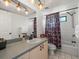 Nicely updated bathroom with vanity, shower with tub, and decorative lighting fixture at 3305 Westmoreland Dr, Tampa, FL 33618