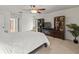 Bedroom features white walls, ceiling fan, entertainment center and a view of the bathroom at 3305 Westmoreland Dr, Tampa, FL 33618