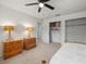 Bright bedroom with two nightstands, ceiling fan, and open closet storage at 3305 Westmoreland Dr, Tampa, FL 33618