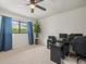 Bright bedroom with a dark wood computer desk and dark blue curtains at 3305 Westmoreland Dr, Tampa, FL 33618