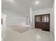 Inviting foyer with tile flooring and decorative glass double doors at 3305 Westmoreland Dr, Tampa, FL 33618