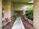 Inviting front entrance with brick accents and lush greenery at 3305 Westmoreland Dr, Tampa, FL 33618