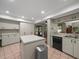 Bright kitchen featuring ample storage, a dishwasher, and views to the backyard at 3305 Westmoreland Dr, Tampa, FL 33618