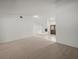 Open living area with neutral carpet and view of front door at 3305 Westmoreland Dr, Tampa, FL 33618