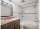 Charming bathroom features a vanity, toilet, and shower-tub combination with white subway tile at 3325 Bayshore Blvd # A17, Tampa, FL 33629