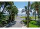 Lush trees line the walkway of this property along Bayshore Boulevard with views of the bay at 3325 Bayshore Blvd # A17, Tampa, FL 33629