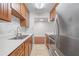 This efficiently designed kitchen showcases warm wood cabinets and stainless steel appliances at 3325 Bayshore Blvd # A17, Tampa, FL 33629