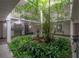 Lobby features indoor garden with fountain and seating areas on multiple stories of the condo building at 3325 Bayshore Blvd # A17, Tampa, FL 33629